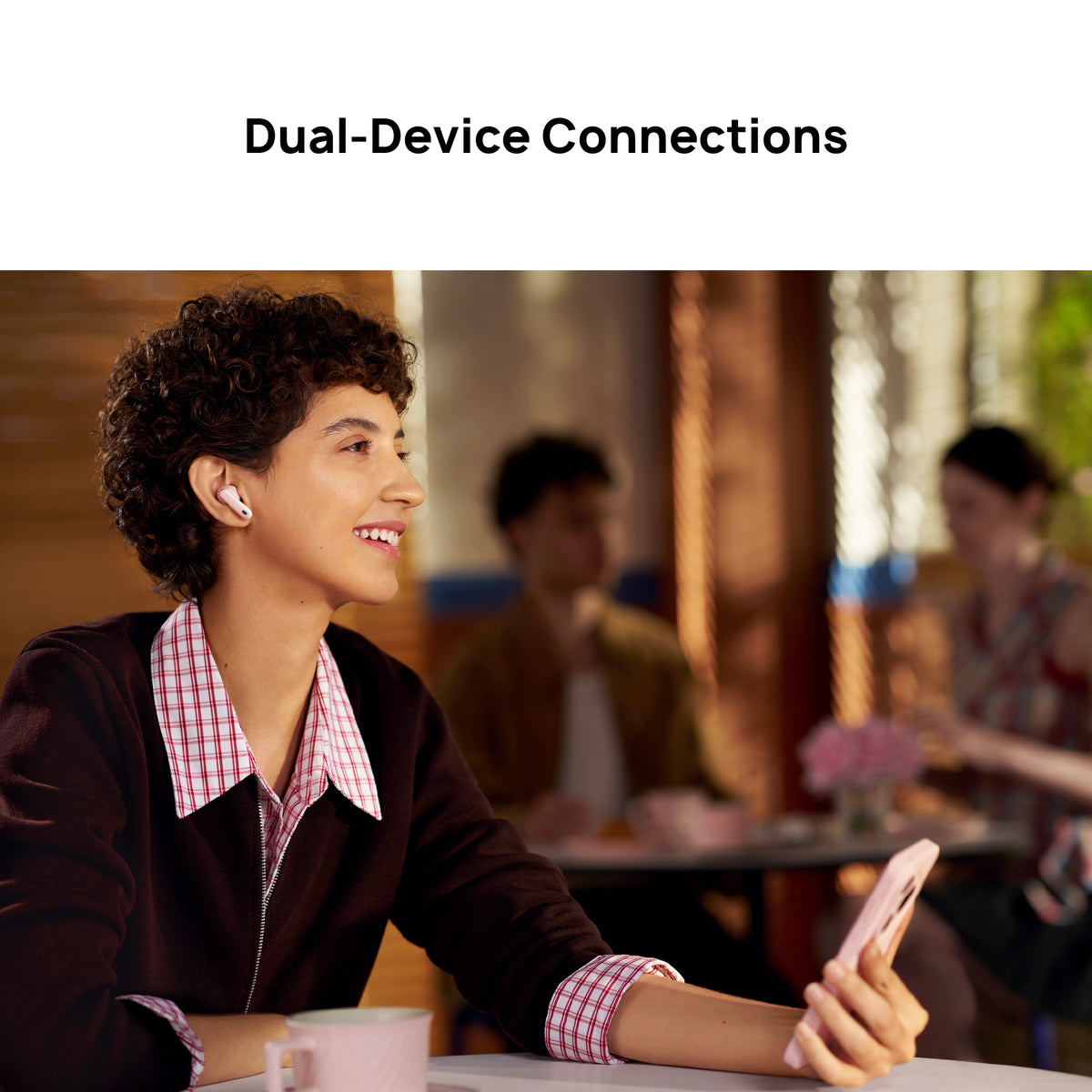 Person using a smartphone with 'Dual-Device Connections' text above